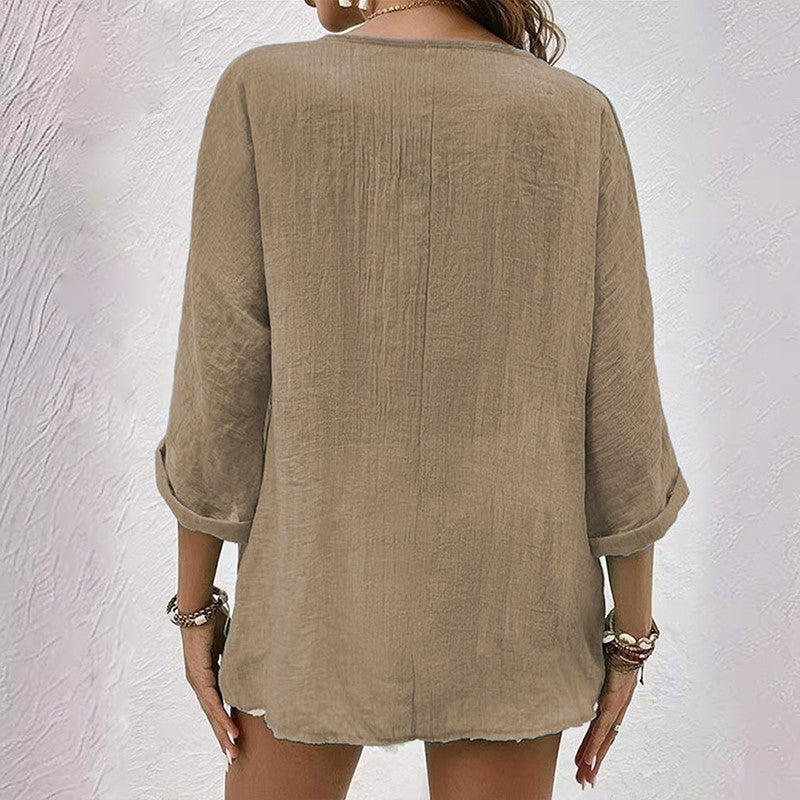 Blouse femme à col en V avec boutons sur le devant