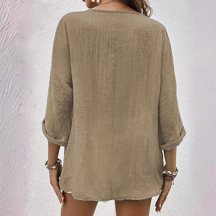 Blouse femme à col en V avec boutons sur le devant