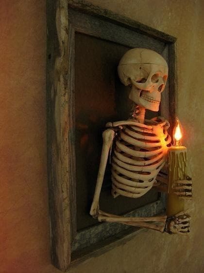 Halloween's Framed Skeleton Torso Wall Decor with Flashing Candle Light